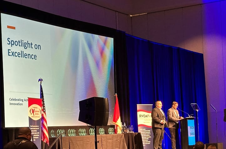 Chris Dominis and Tyler Kelly Announcing 2025 RECT Awards at RVDAs Spotlight on Excellence Luncheon